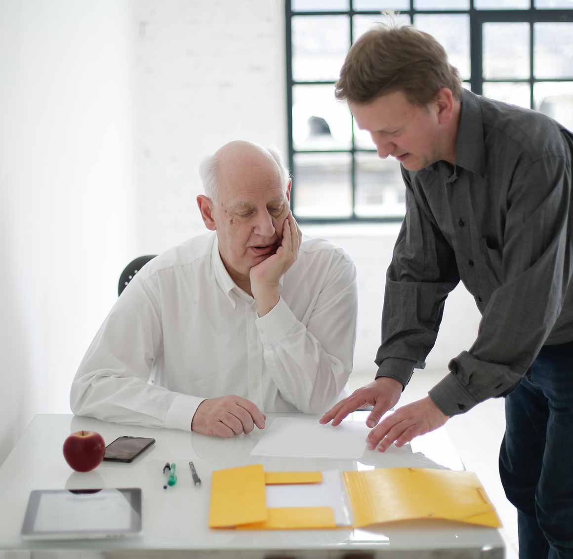 Accounting Two team members discussing a report